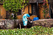 Kerala backwaters, our three hours neighborhood tour in the narrow canoe towards Vembanad Lake and along one of the  narrow canal running near our guest house at Kumarakom. 